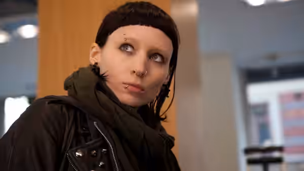 Lisbeth Salander (Rooney Mara) looks to the side indoors