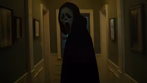 A masked figure in a black robe stands in a dimly lit hallway