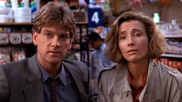 Mike Church (Kenneth Branagh) and Grace (Emma Thompson) standing in a store aisle
