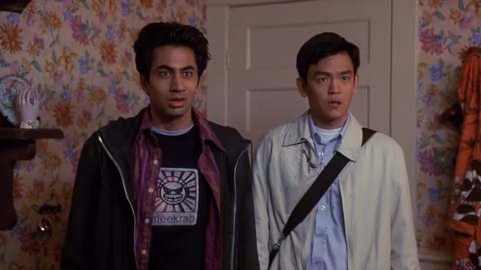 Harold (John Cho) and Kumar (Kal Penn) stand startled in a flowered room