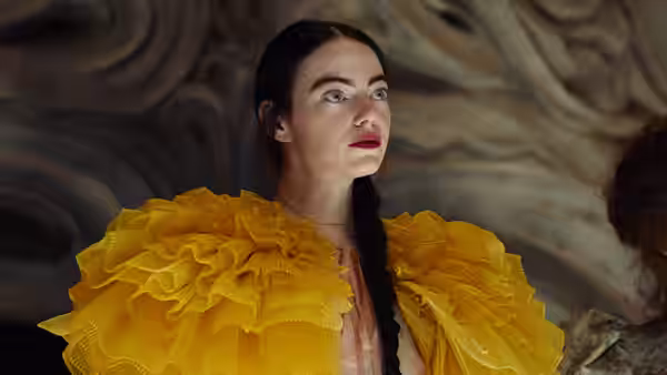 woman in yellow ruffled dress looking upward with wide eyes