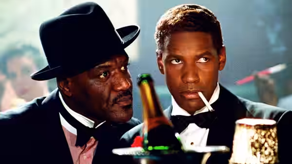 West Indian Archie (Delroy Lindo) and Malcolm X (Denzel Washington) at a table