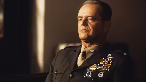 Col. Nathan R. Jessep (Jack Nicholson) seated in a dimly lit room