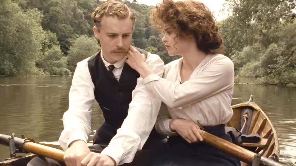 Helen Schlegel (Helena Bonham Carter) touching a man's face in a rowboat