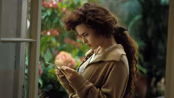 Helen Schlegel (Helena Bonham Carter) reading a letter by an open window