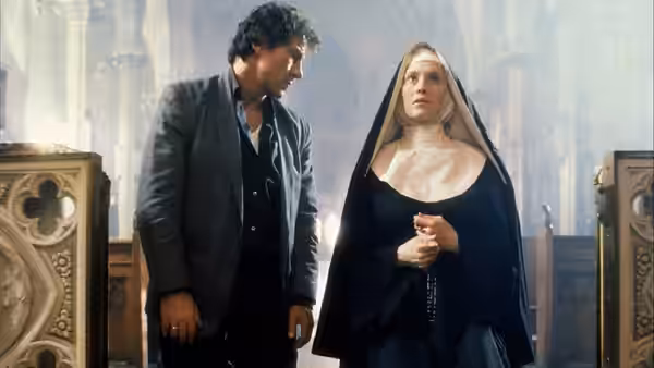 LT (Harvey Keitel) standing next to The Nun (Frankie Thorn) in church