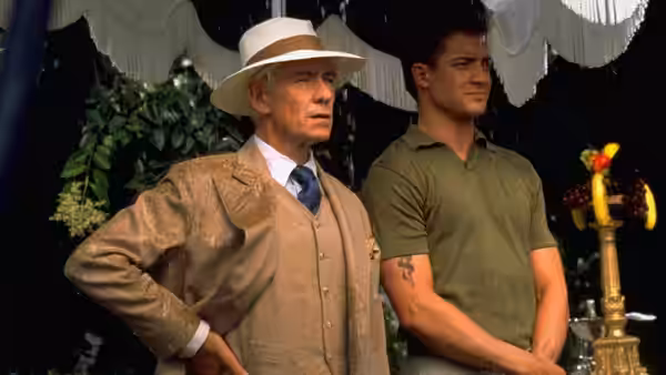 James Whale (Ian McKellen) and Clayton Boone (Brendan Fraser) at an outdoor event in rain