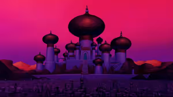 A grand palace with domes overlooking a city under a pink sky