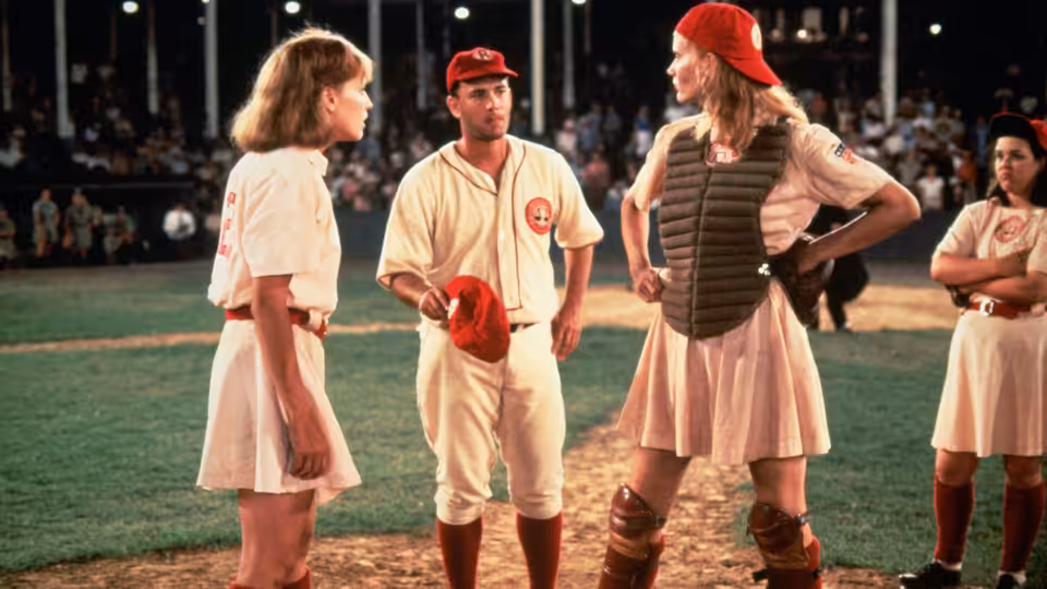 Jimmy Dugan (Tom Hanks) talking with Dottie Hinson (Geena Davis) on the baseball field
