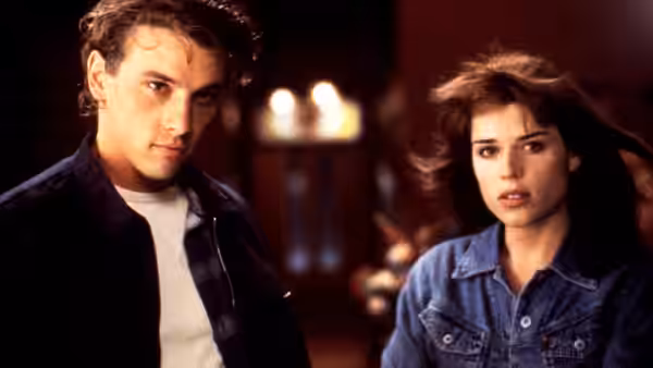 Billy (Skeet Ulrich) and Sidney (Neve Campbell) standing together indoors
