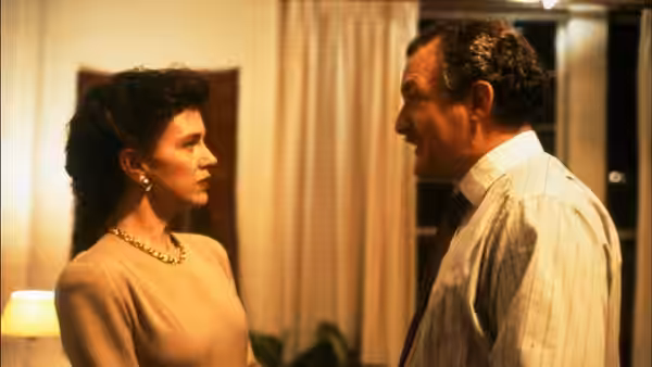 Sally (Judy Davis) and Jack (Sydney Pollack) standing close and facing each other