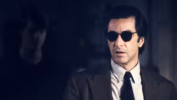 Lt. Col. Frank Slade (Al Pacino) wearing sunglasses with Charlie Simms (Chris O'Donnell) behind him