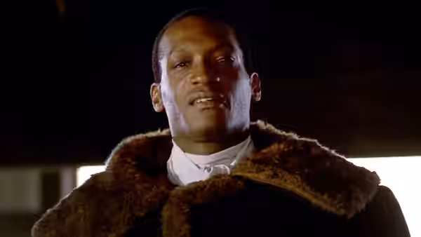 Candyman (Tony Todd) gazing upwards with mouth slightly open in shadow