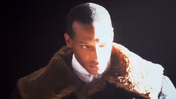 Candyman (Tony Todd) looking sideways with intense stare in close-up