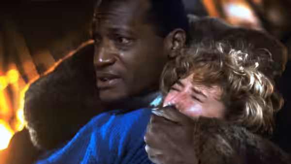Candyman (Tony Todd) holding Helen Lyle (Virginia Madsen) close in his arms