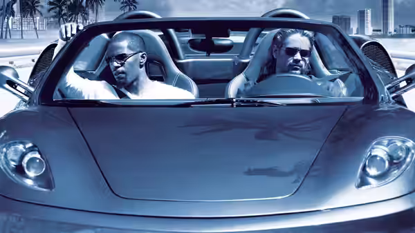 Rico Tubbs (Jamie Foxx) and Sonny Crockett (Colin Farrell) ride in a convertible through Miami