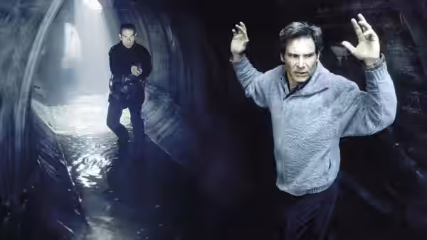 Richard Kimble (Harrison Ford) raising his hands in a dark tunnel