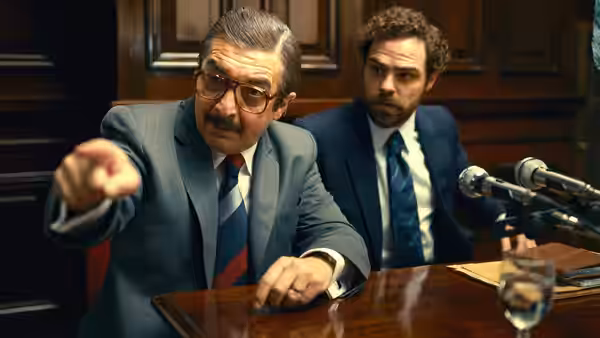 Julio Strassera (Ricardo Darín) points across a courtroom table as Luis Moreno Ocampo (Peter Lanzani) watches
