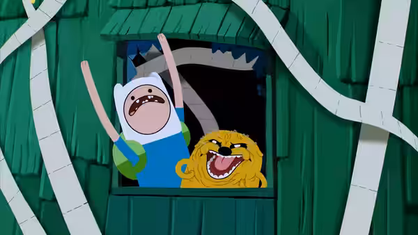 Finn throws up his arms beside Jake, who peers through a window in a wooden house