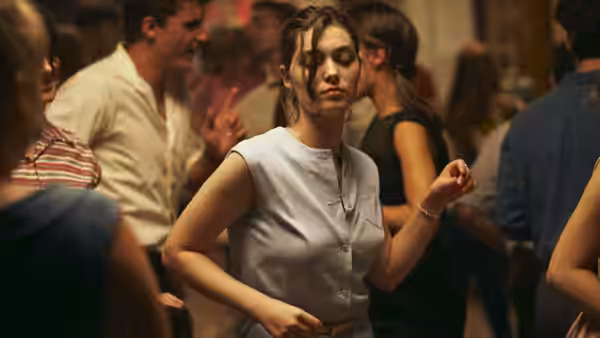 Anne Duchesne (Anamaria Vartolomei) dances among people at a crowded party
