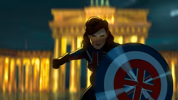 Captain Carter (Hayley Atwell) braces behind her Union Jack shield before illuminated London buildings