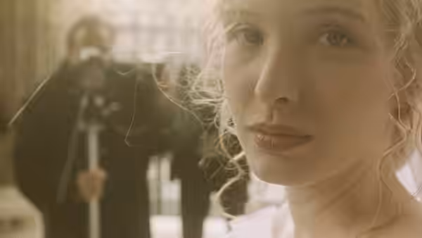 Dominique (Julie Delpy) in close-up with a cameraman behind her