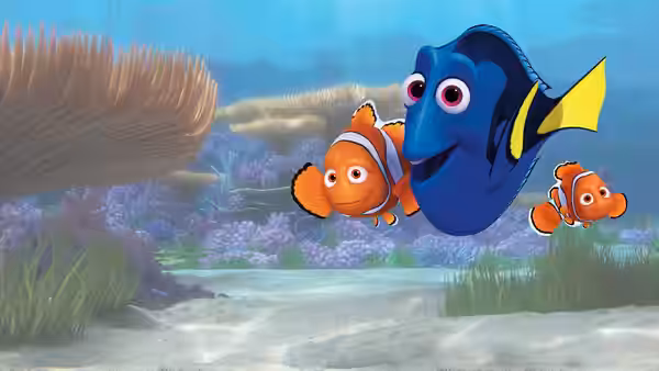 Dory swims through a colorful reef with Marlin and Nemo