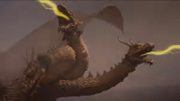 King Ghidorah's heads unleash lightning beams against a smoky mountain backdrop