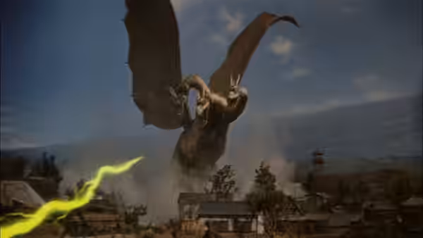 King Ghidorah rises above a town as lightning streaks across the foreground