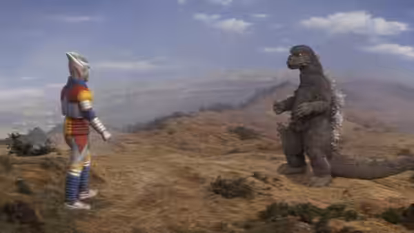 Jet Jaguar and Godzilla face each other across an open plain