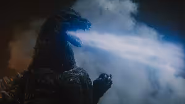 Godzilla unleashes his atomic breath through a billowing cloud