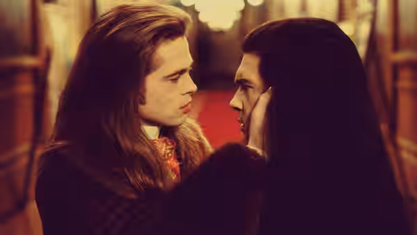 Louis (Brad Pitt) and Armand (Antonio Banderas) gazing at each other closely