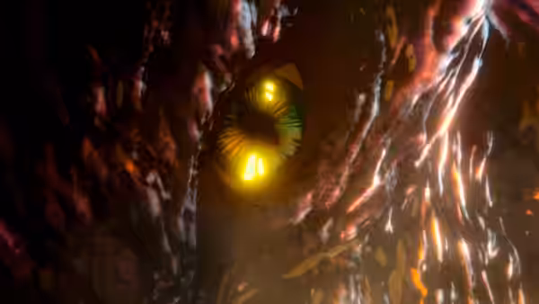 A glowing yellow eye peers from the rough, dark hide of a giant creature