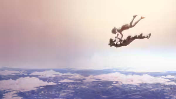 Two figures tumble through the air above a vast blanket of clouds