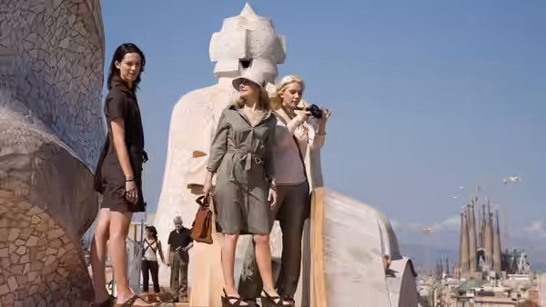 Vicky and Cristina visit a sculptural landmark, while Cristina raises her camera