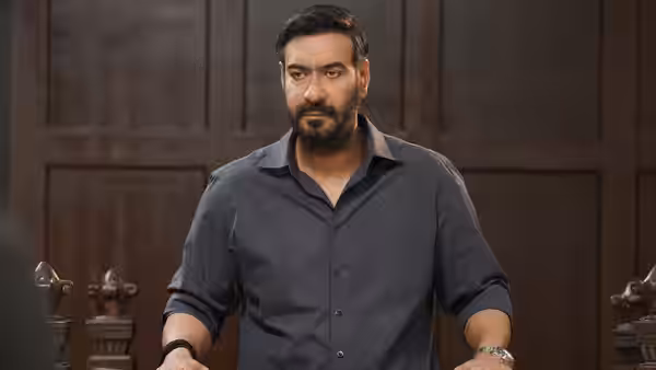 Vijay Salgaonkar (Ajay Devgn) stands before wooden courtroom benches
