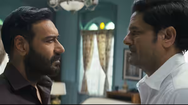 Vijay Salgaonkar (Ajay Devgn) faces a man in a white shirt indoors