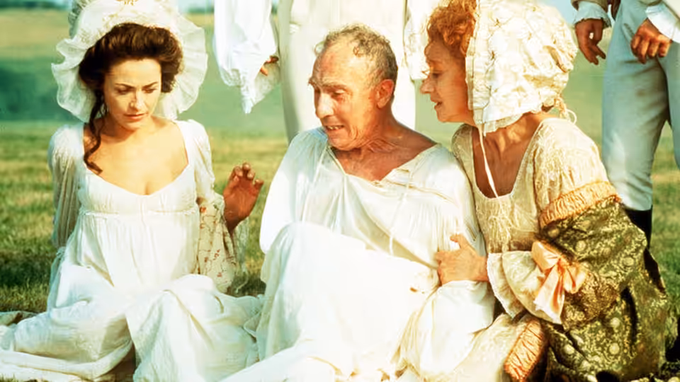 George III reclining on grass supported by two women in white dresses