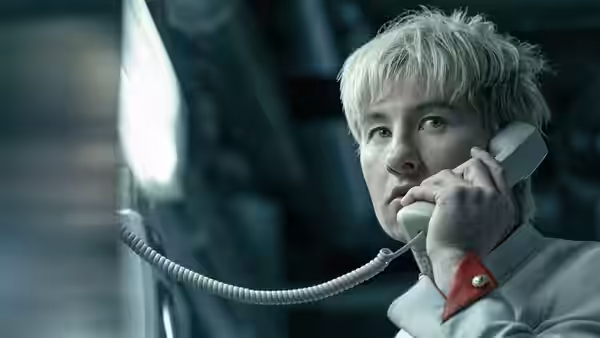 Barry Keoghan as Ormon speaks into a telephone receiver