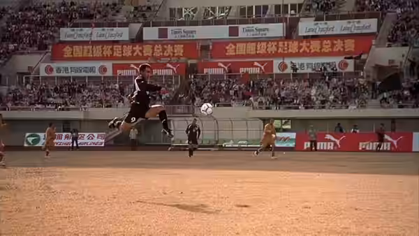 A black-uniformed player leaps to strike the ball during a crowded stadium match