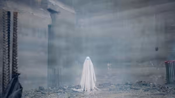 Ghost figure standing in an unfinished concrete building filled with rebar