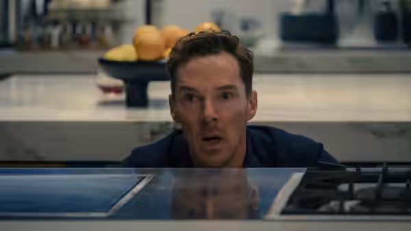Theo Rose (Benedict Cumberbatch) peers over a kitchen counter