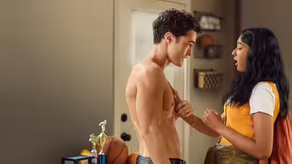 Devi speaks with shirtless Paxton in a bedroom