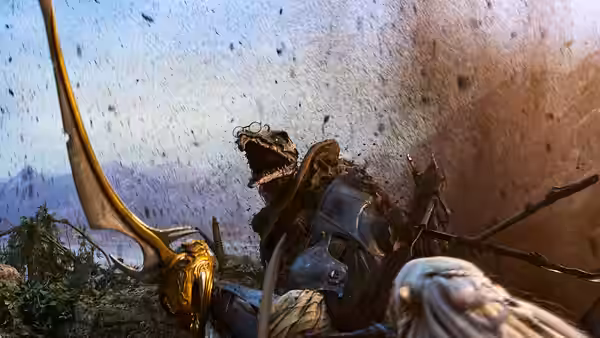 An armored Gelfling looks upward as dust and debris swirl around a tall staff