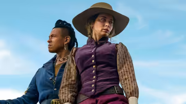 Eli Whipp (Chaske Spencer) and Lady Cornelia Locke (Emily Blunt) stand side by side outdoors