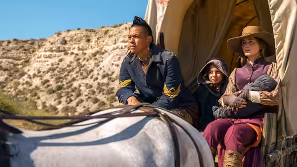 Eli Whipp (Chaske Spencer) drives a wagon carrying Cornelia and a child through rocky country