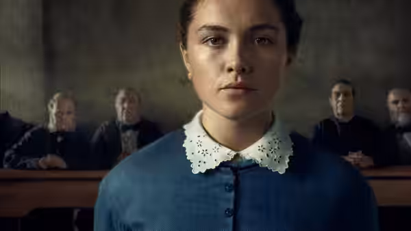 Lib Wright (Florence Pugh) sits before a panel of men in a dim room