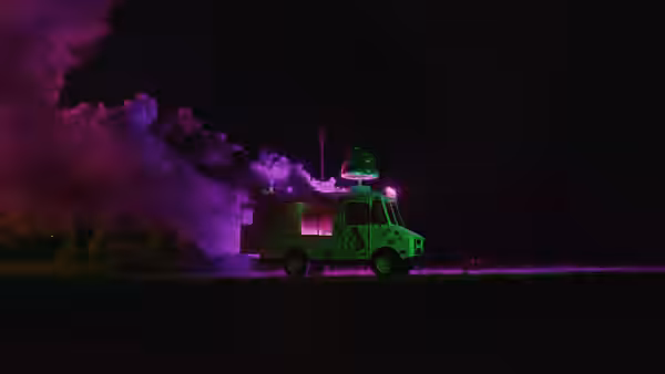 A brightly lit truck sits amid billowing purple smoke at night