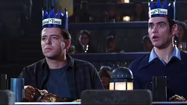 Steven (Matthew Broderick) and Cable Guy (Jim Carrey) wear paper crowns at a banquet