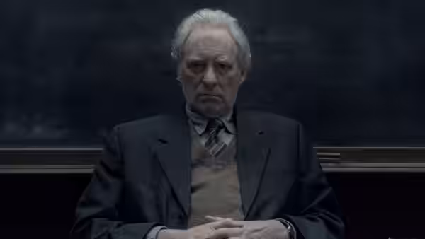 Stephen Brigstocke (Kevin Kline) sits with his hands clasped